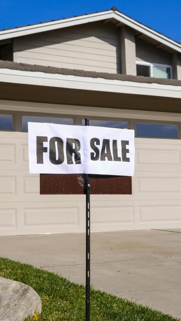 Sell my house Conroe TX - for sale sign in front of home in Conroe Texas neighborhood