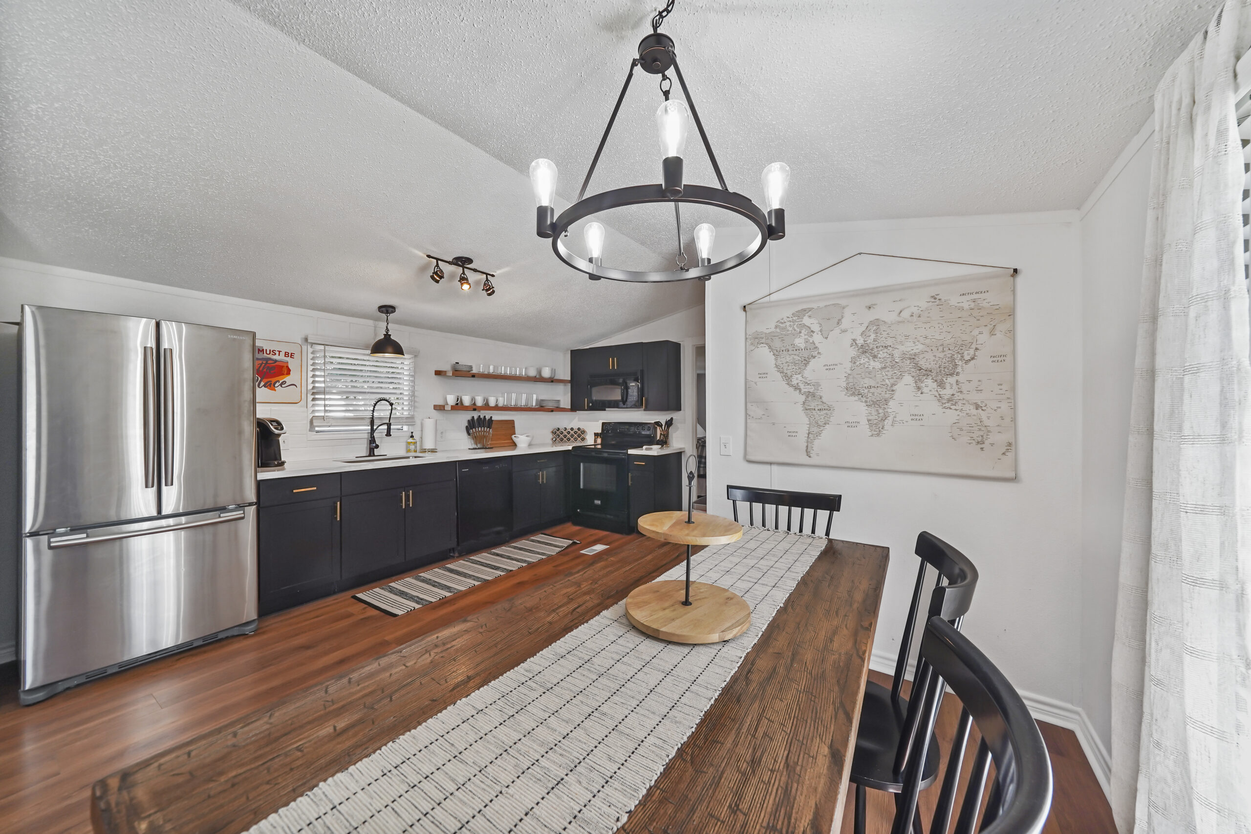 Kitchen view with eat-up counter and refrigerator