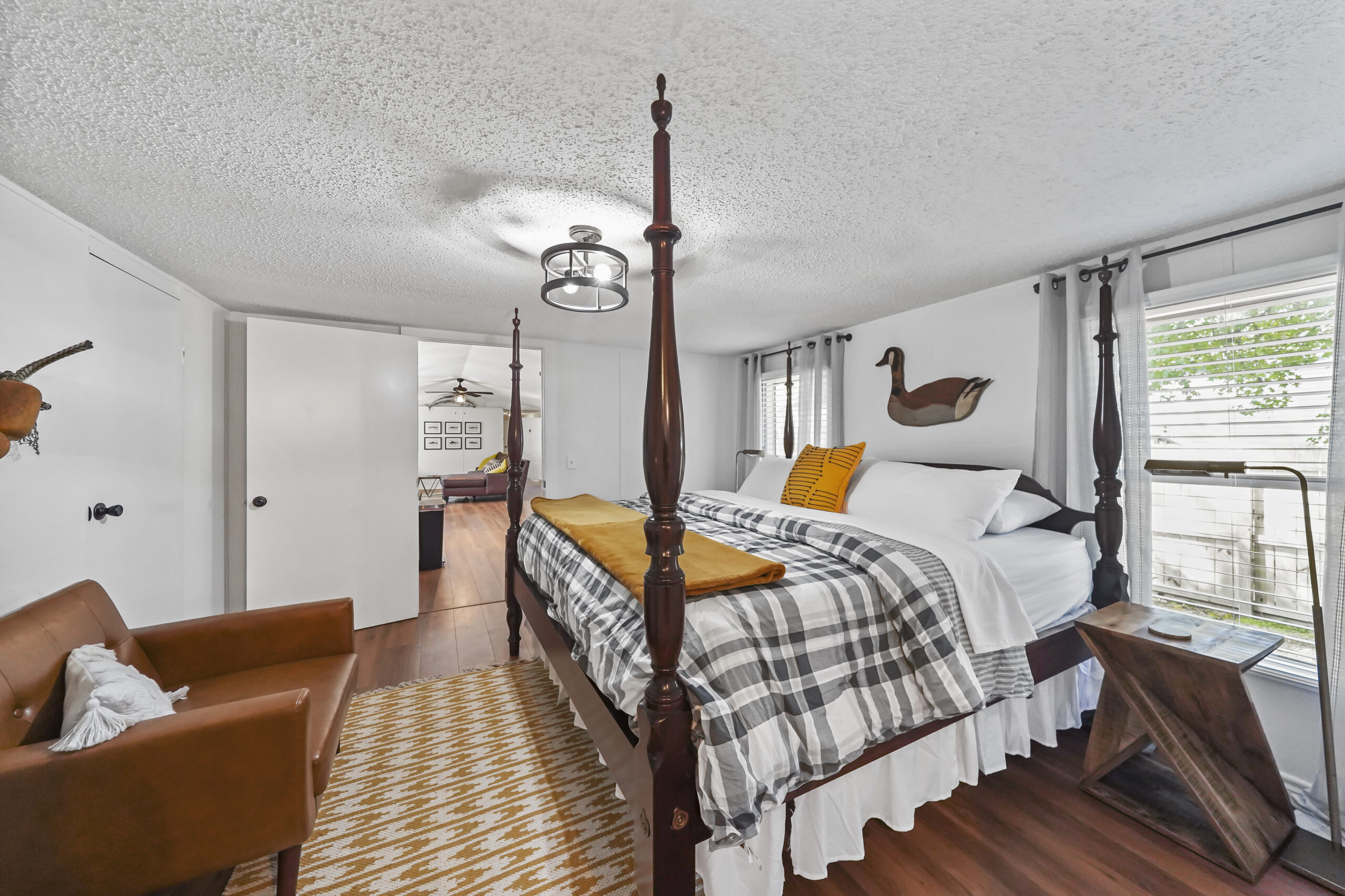 Primary bedroom with four-poster bed