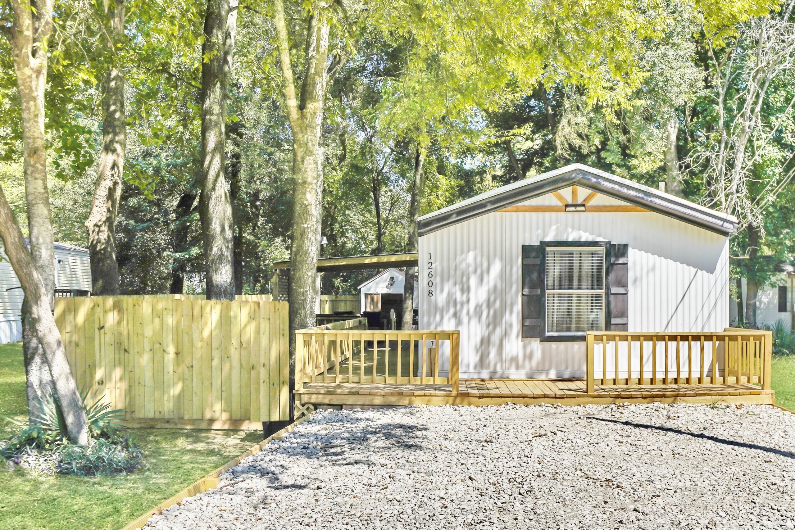 12608 Lazy Cove Dr - front exterior with ramp and mature trees