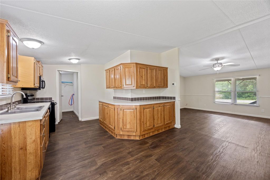 Kitchen with ample cabinet storage and window
