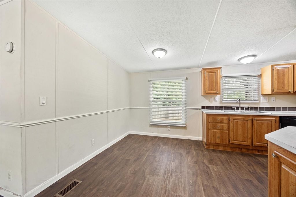 Living area open to the kitchen in this 3 bedroom Willis TX home