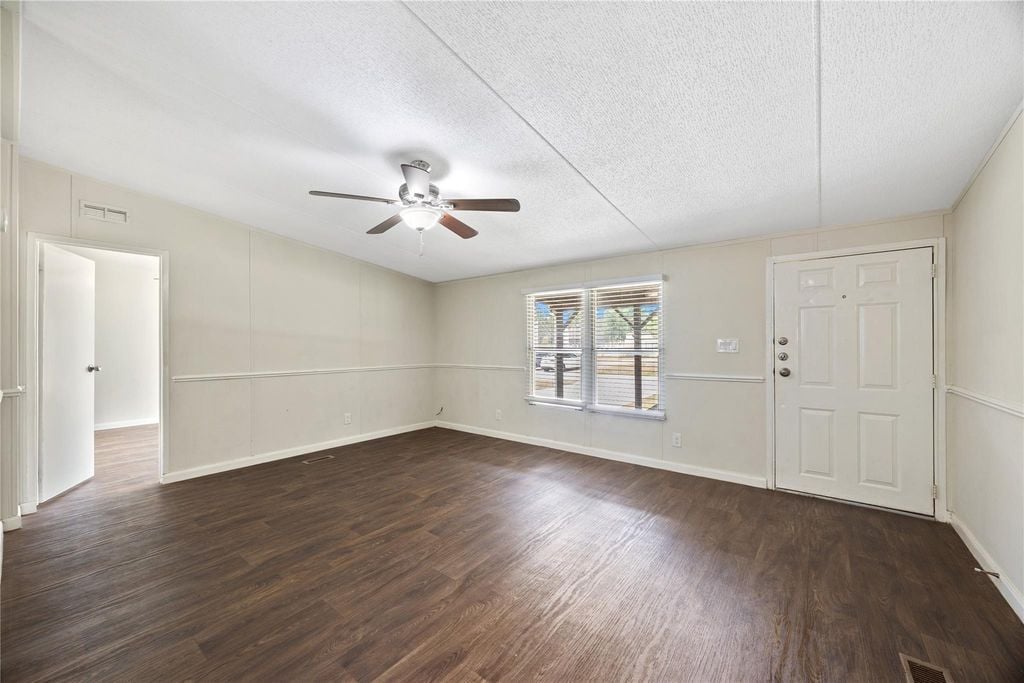 Living room and front entry with vinyl plank flooring