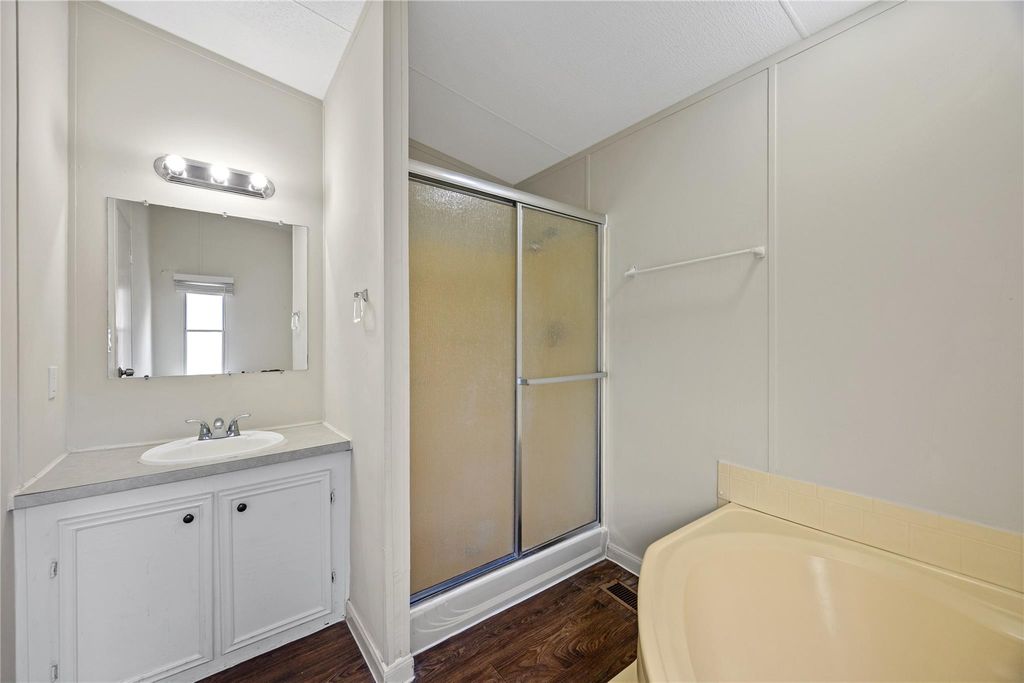 Primary bath vanity with storage and separate shower
