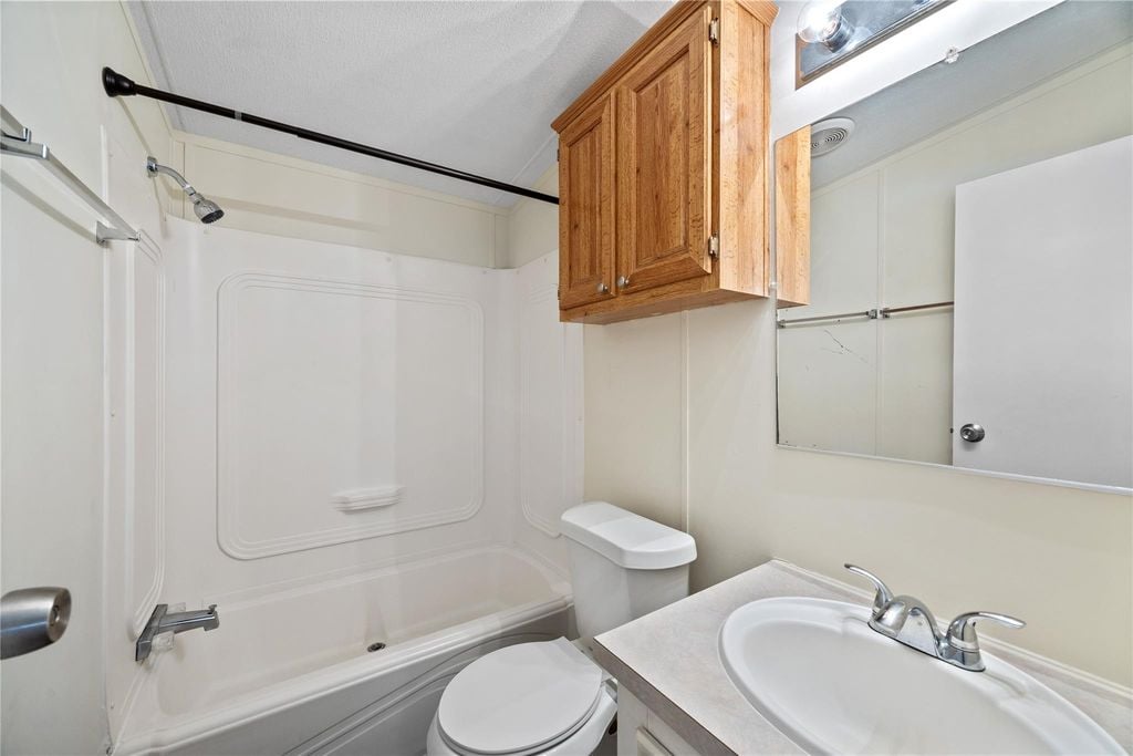 Second full bathroom with tub and shower combo