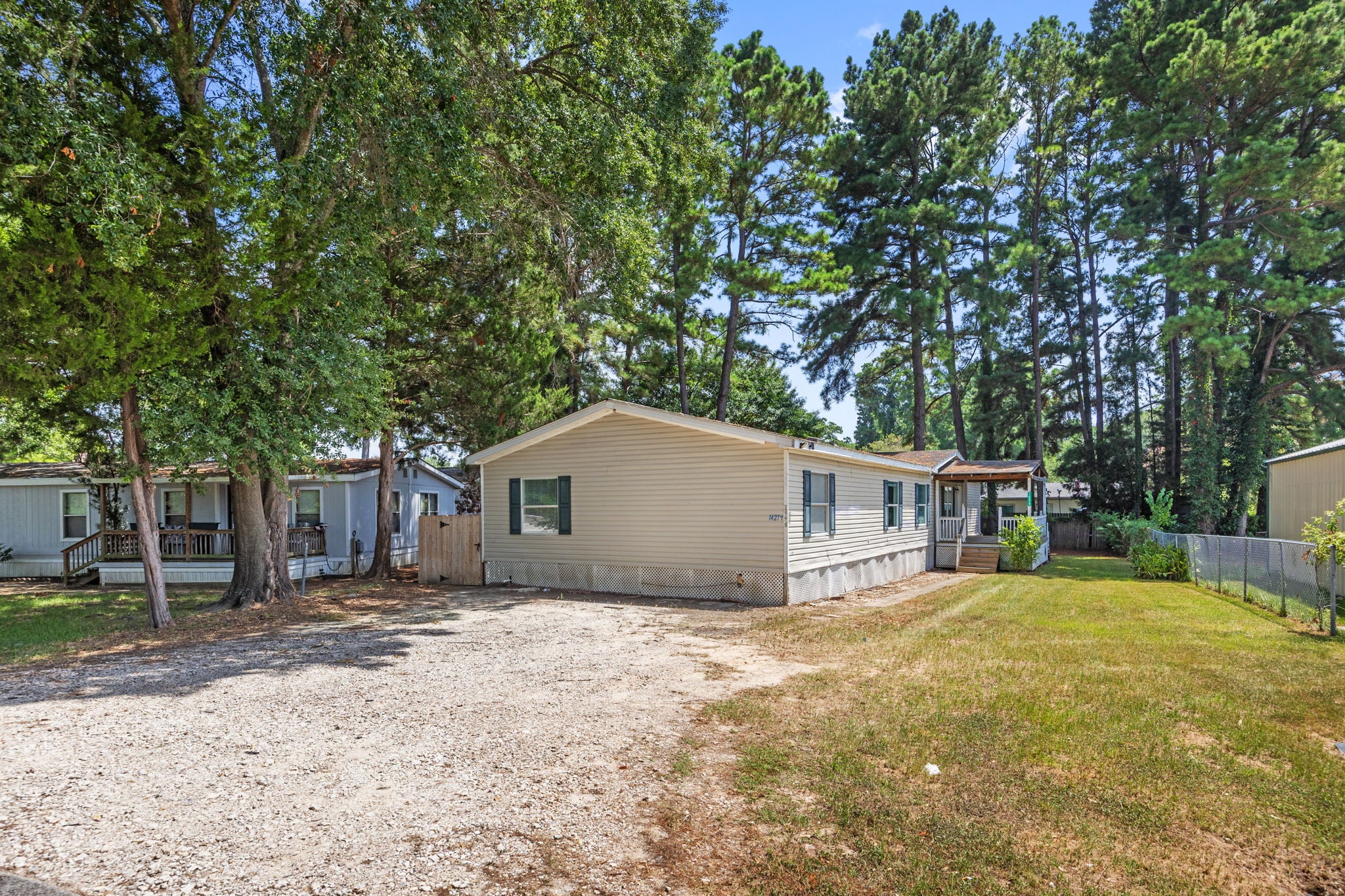 Front exterior of 14279 Shadow Bay Dr, Willis TX, a 4 bedroom doublewide for sale on its own deeded lot near Lake Conroe
