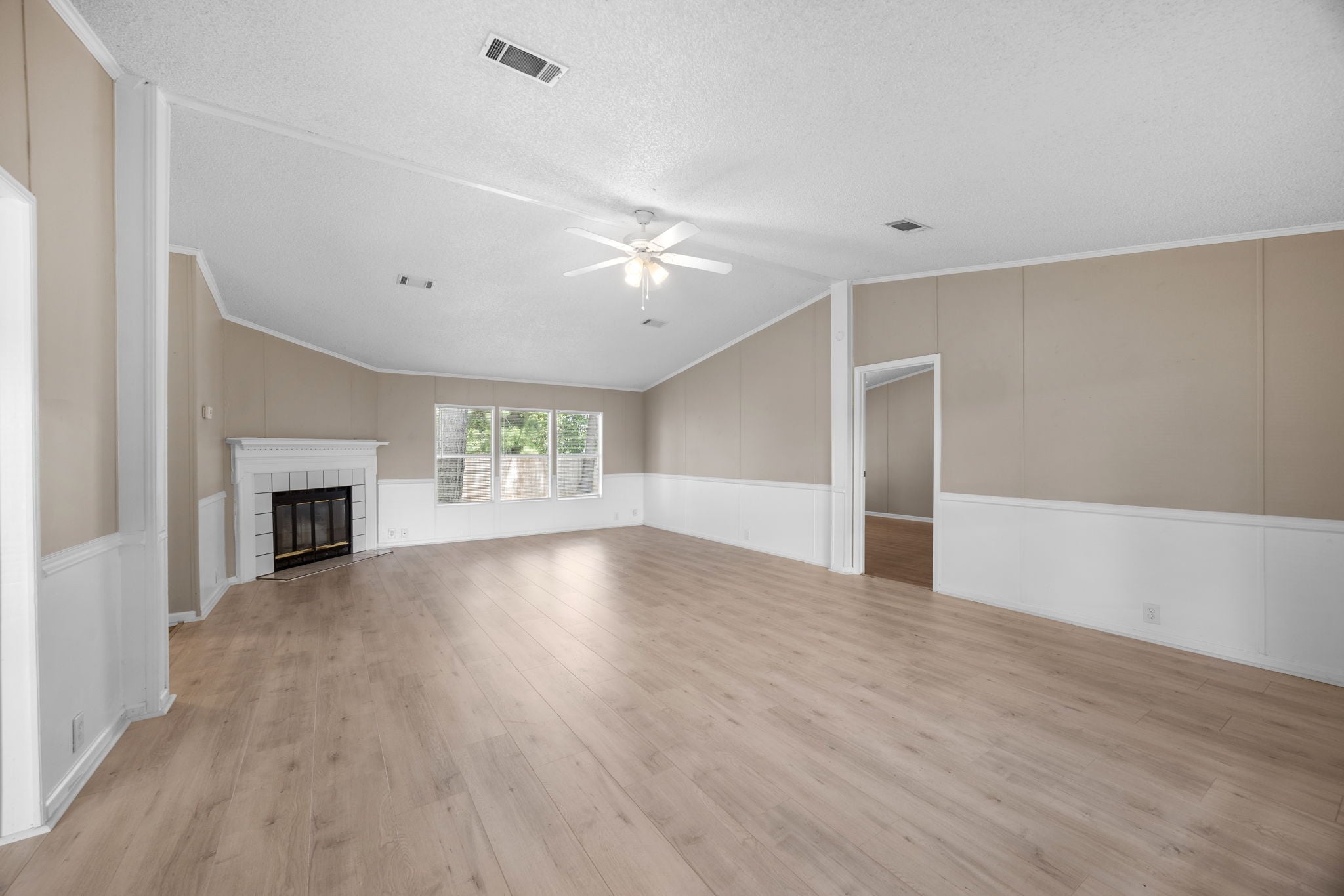 Wide view of the living room and fireplace wall. 14279 Shadow Bay Dr, Willis TX