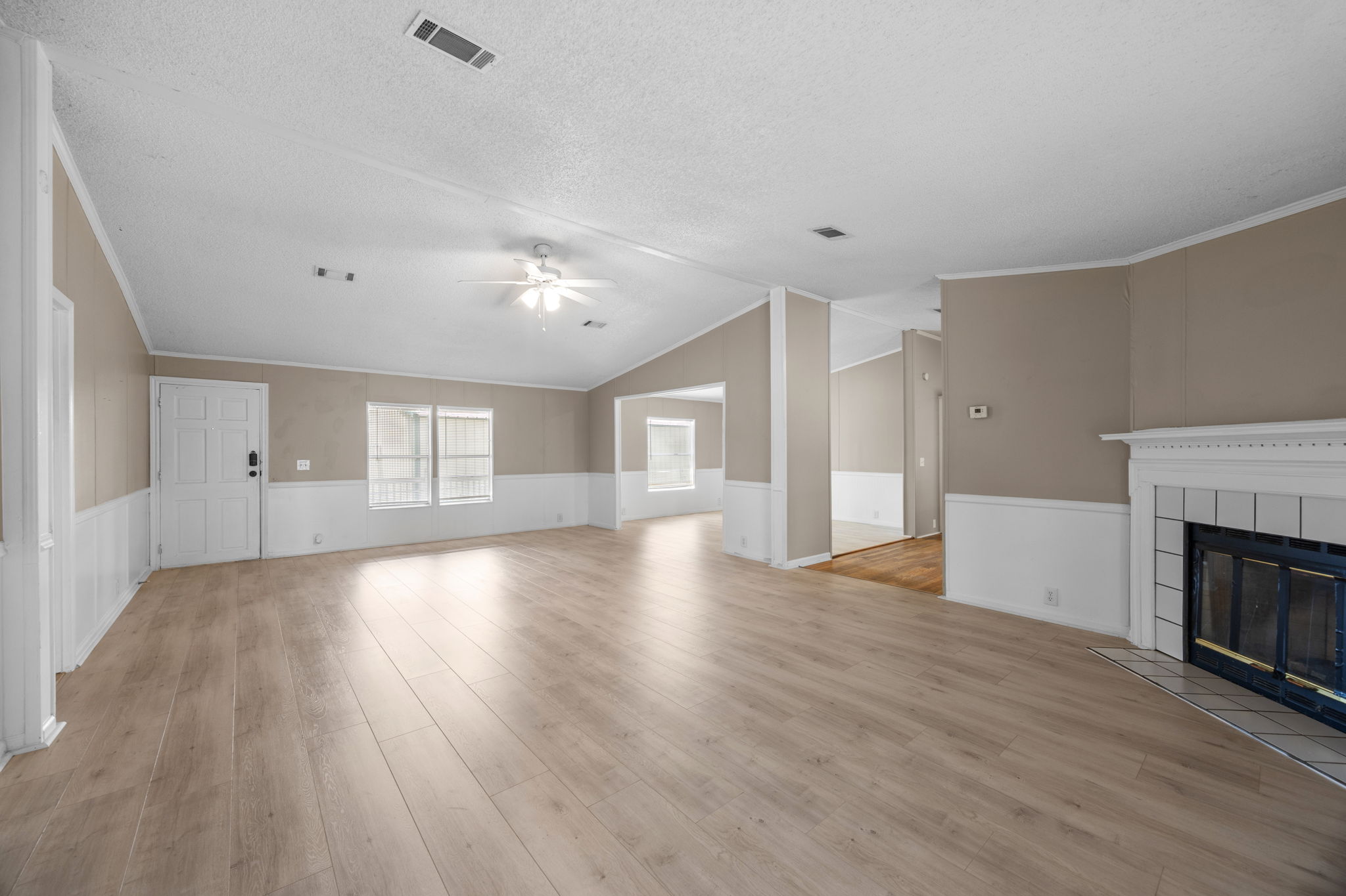 Living room and fireplace, second angle. 14279 Shadow Bay Dr, Willis TX