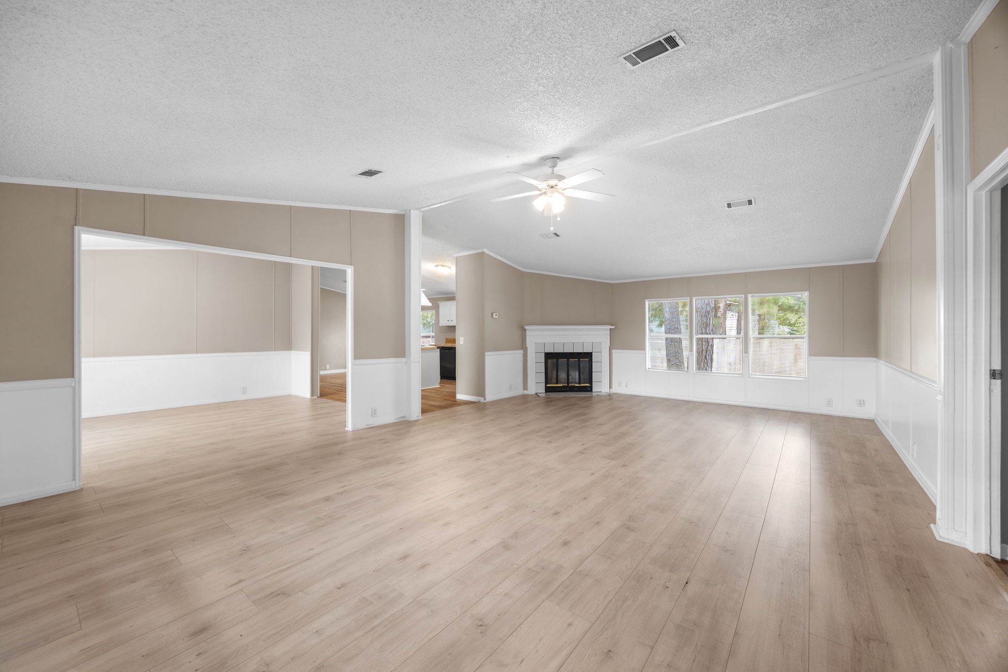 Living room. New water resistant laminate flooring installed 2026. 14279 Shadow Bay Dr, Willis TX
