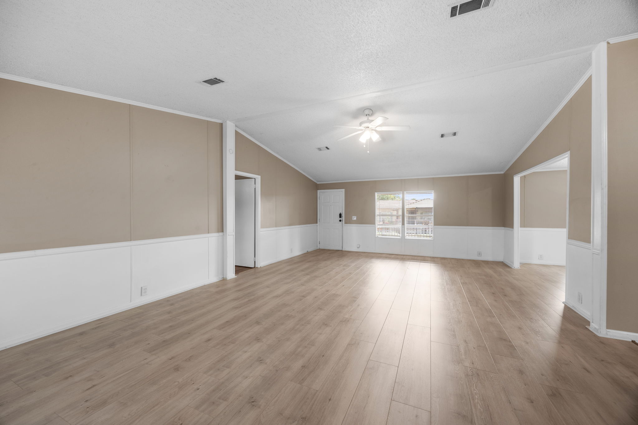 Open living and dining area, roughly 27 feet end to end. 14279 Shadow Bay Dr, Willis TX
