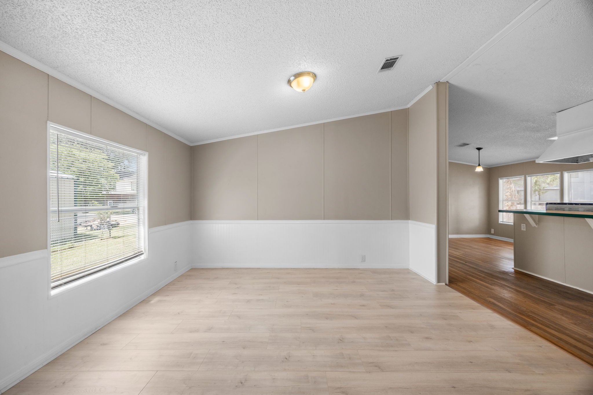 Dining area with window, kitchen beyond. 14279 Shadow Bay Dr, Willis TX