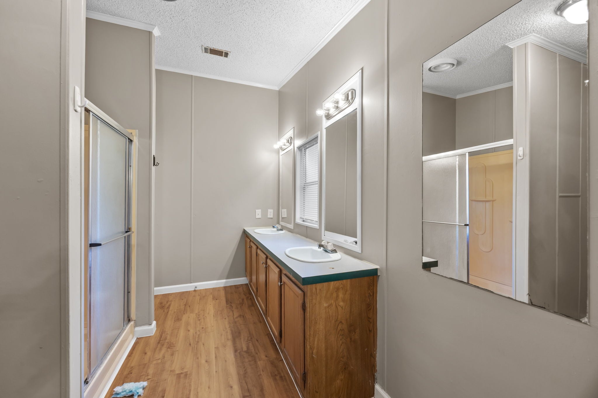 Primary bath walk in shower with sliding glass door. 14279 Shadow Bay Dr, Willis TX