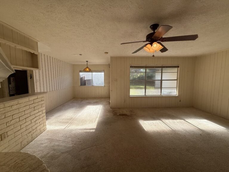 2830 Shadowdale Dr Houston TX family room seating area by the brick fireplace