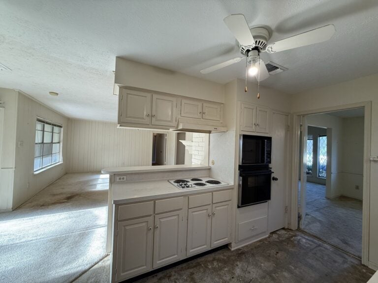 2830 Shadowdale Dr Houston TX kitchen with breakfast bar open to the family room