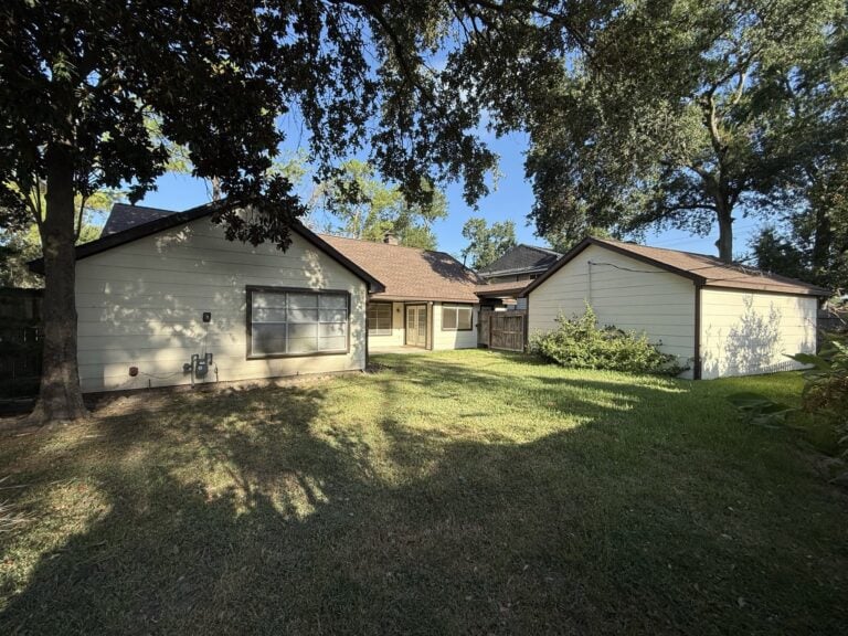 2830 Shadowdale Dr Houston TX fully fenced backyard with mature trees