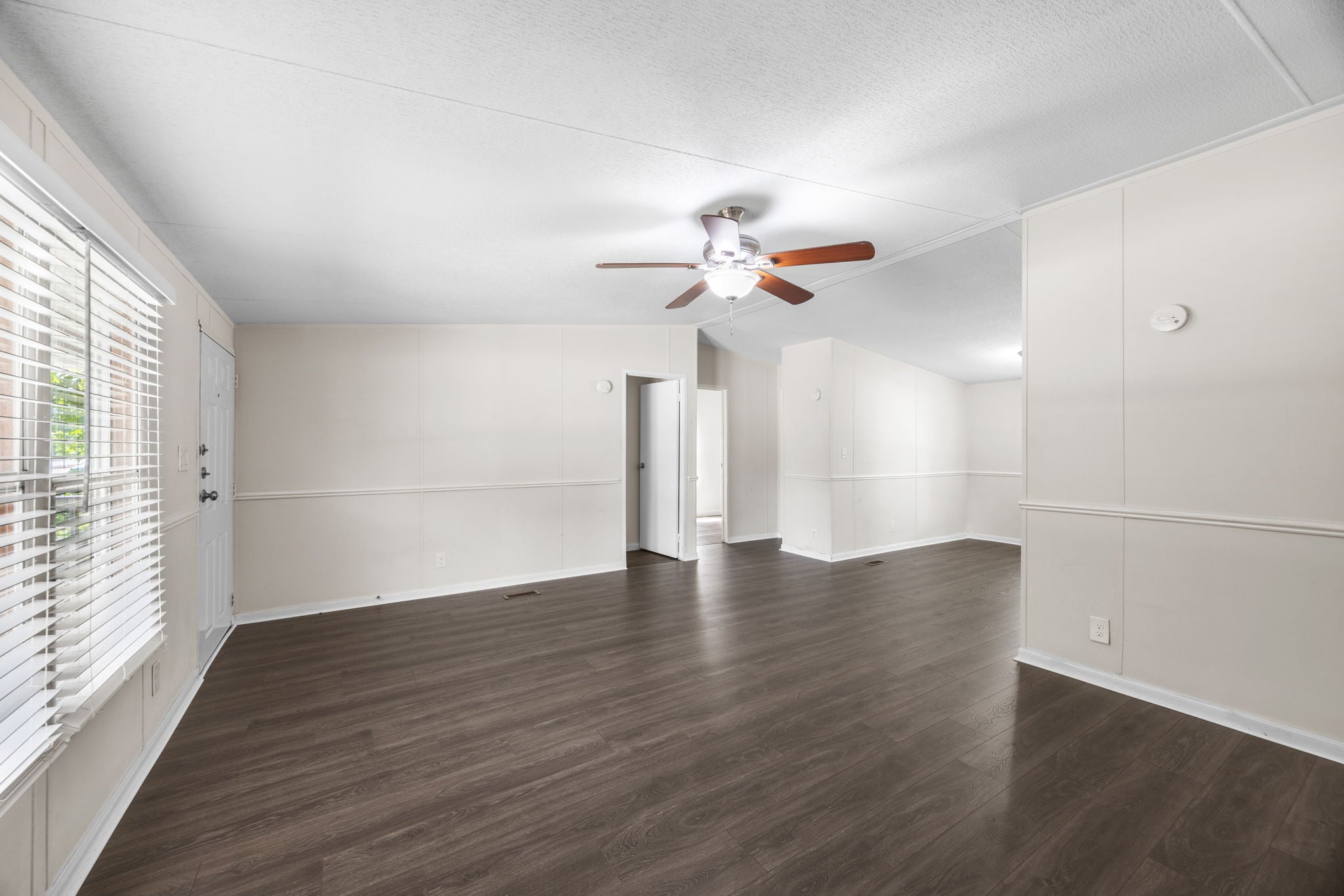 9642 Live Oak Trl Willis TX - Bright, open living room with ceiling fan